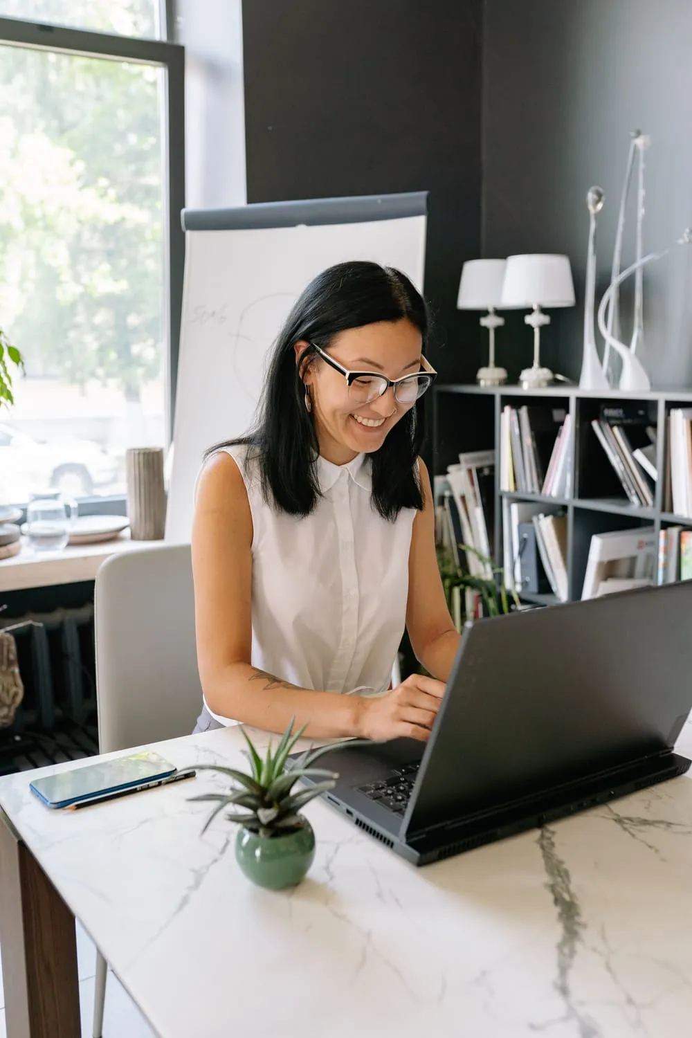 A recruiter finalizing a direct-hire placement at her desk.